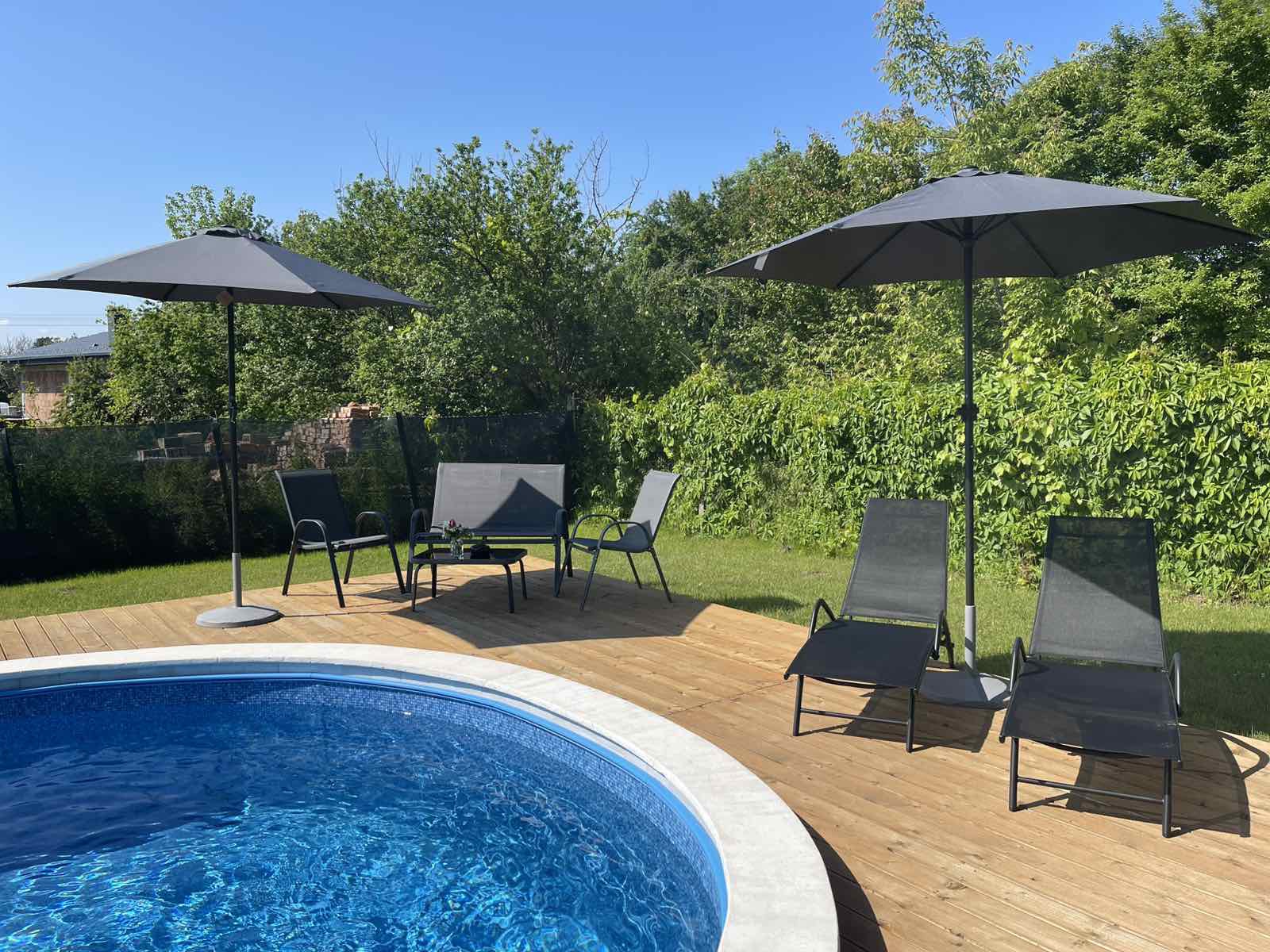 Pool with sunbeds and umbrellas