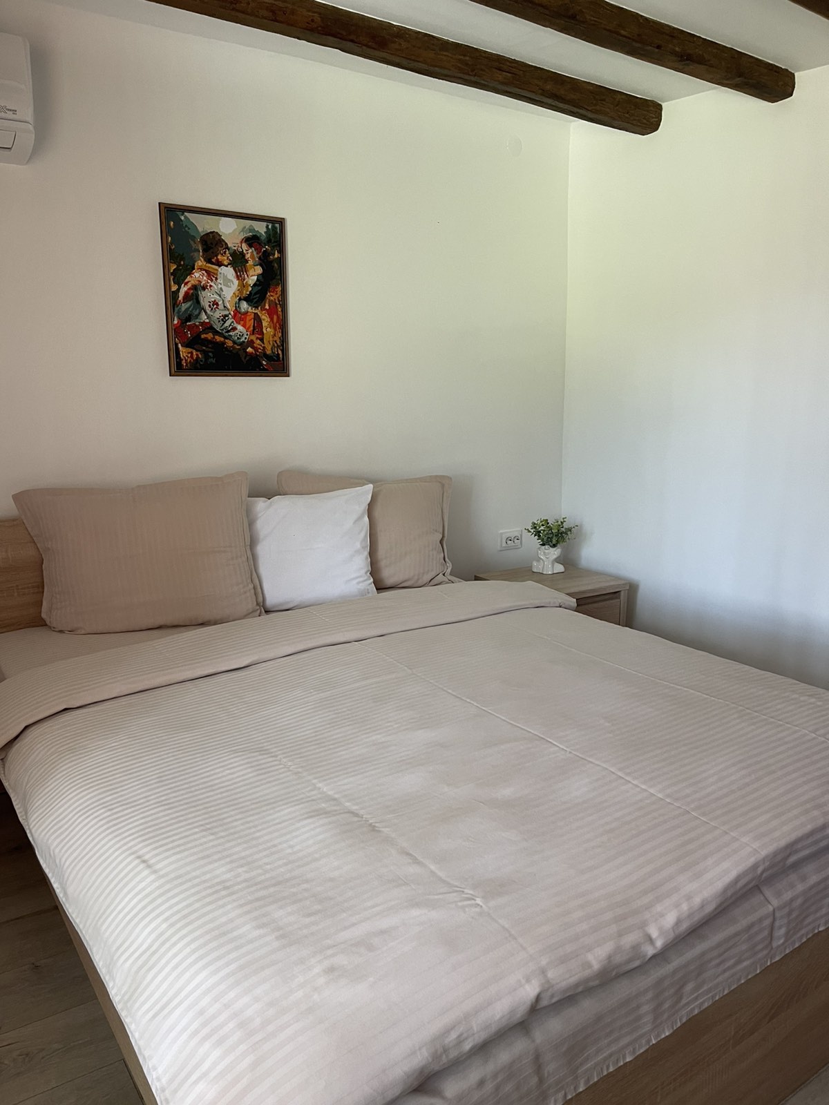 Cozy bedroom with wall painting